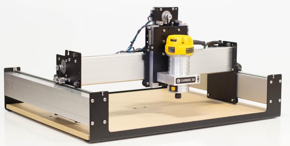 Compact desktop CNC router, Shapeoko 3, with aluminum frame and spindle motor.