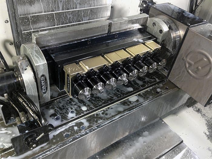 Fourth Axis machine with collet blocks in metal fabrication.