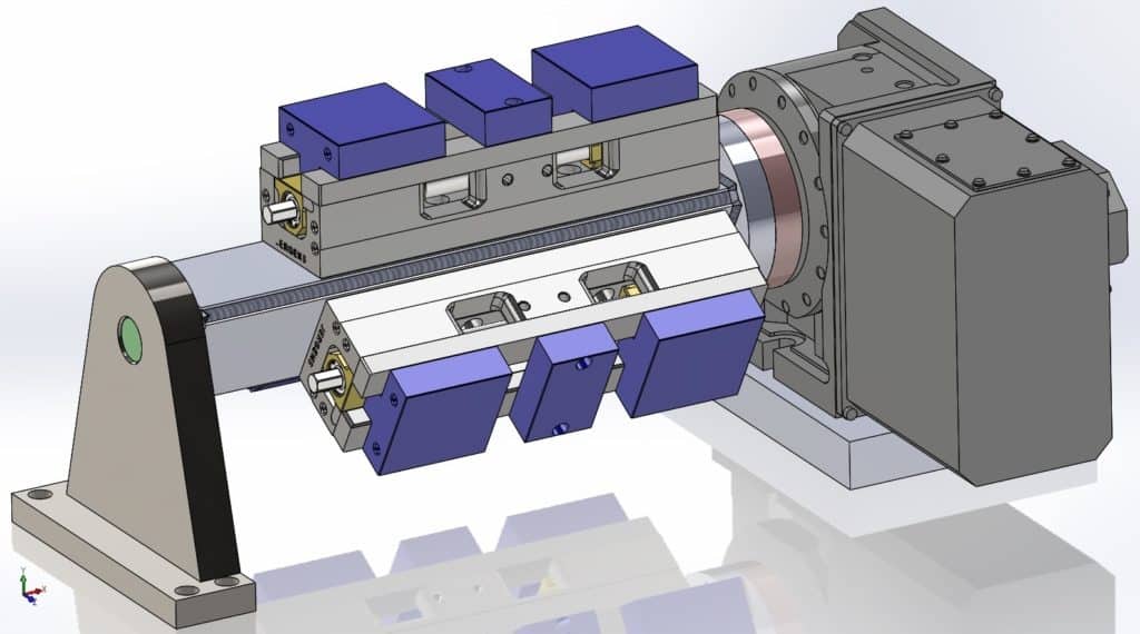 Fourth-axis mounted vises system with metal components in gray, blue, and silver.