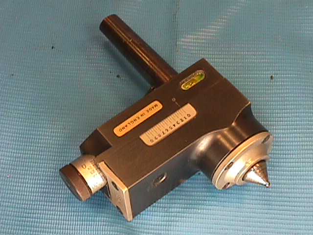 Precision measuring tool with cylindrical body and pointed tip featuring a scale for accurate dimension measurement.