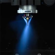 Blue coolant nozzle in machining application.