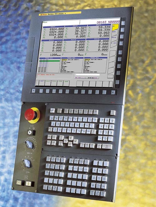 Complex control panel with display screen and various buttons and controls.