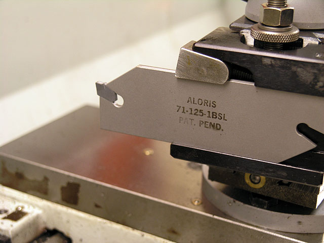 Metal tool with engraved text "ALORIS 71-125-1BSL PAT. PEND.".
