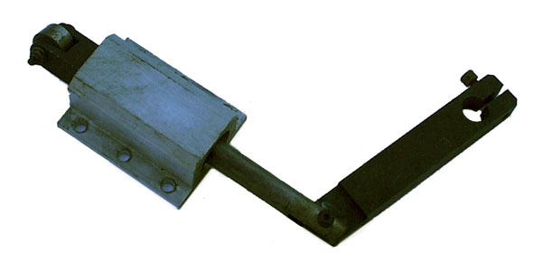 Metal device with two cylindrical ends and a V-shaped bracket.