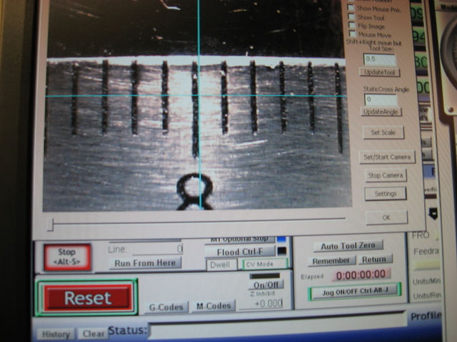 CNC software screenshot with 3D model and toolbars.