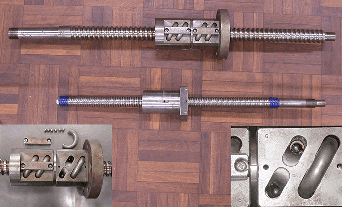 Metal component with threaded rod and handle.