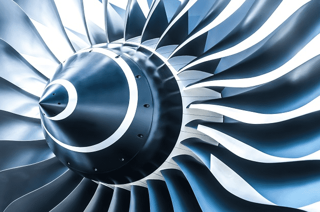 Airplane engine turbine blade with intricate design and metallic surface.