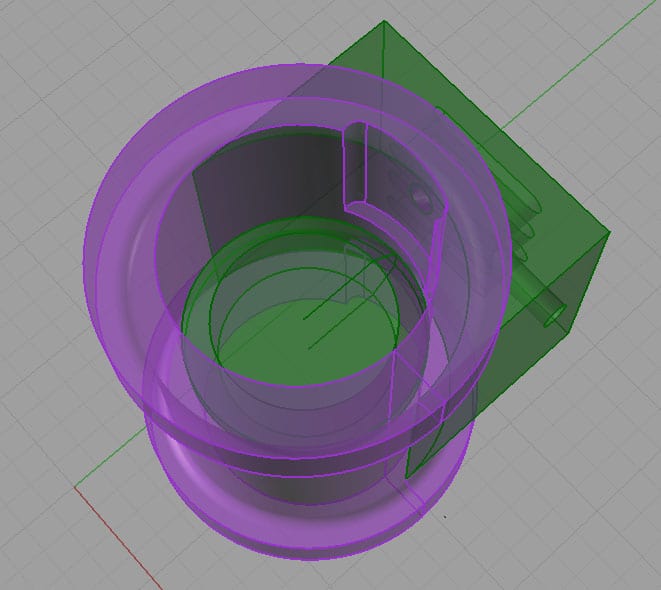 Circular component with purple outer ring and green inner components.