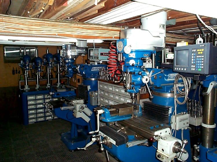 Blue metalworking machinery in a workshop.
