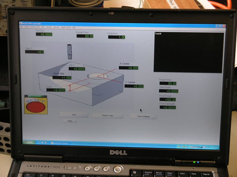 Computer-aided design (CAD) software on laptop screen in machining context.