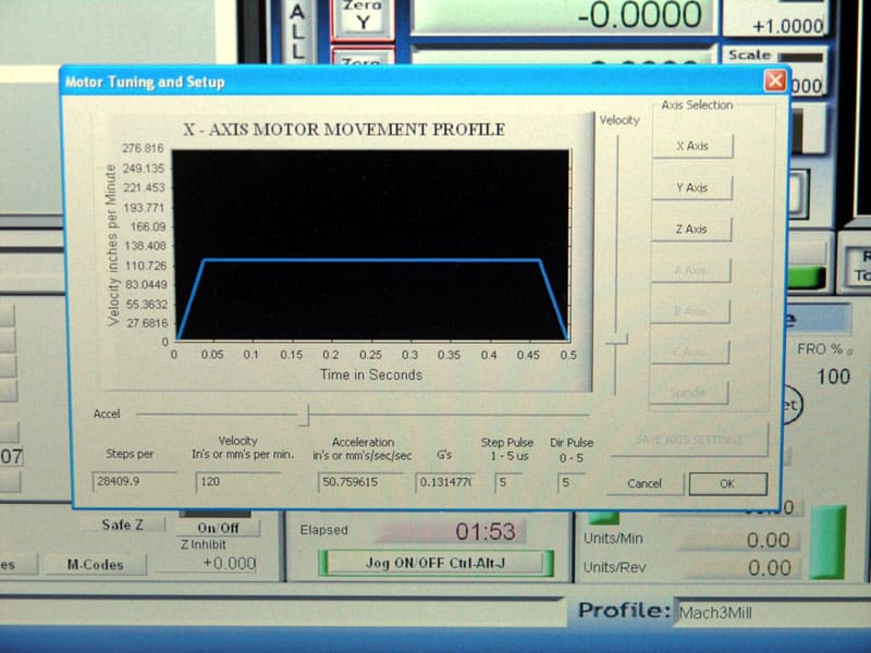 Computer screen displaying X-Axis Motor Movement Profile settings with velocity and time graph.