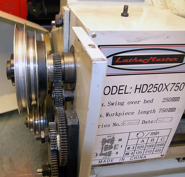 Industrial lathe machine with LatheMaster logo on back label.