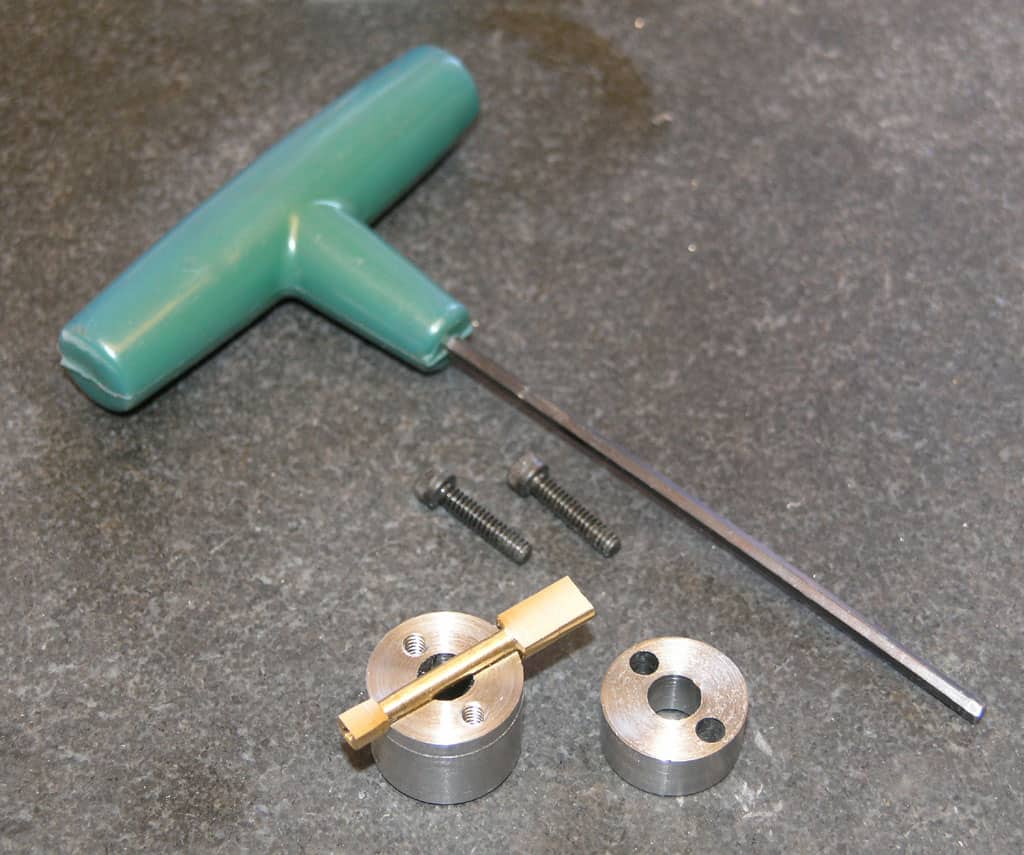 Collection of metal tools on gray surface.