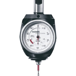 Precision instrument with silver body and white face featuring a black dial surrounded by a metal bezel and a red button.