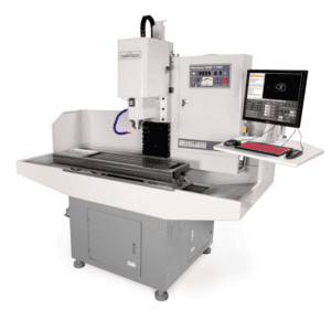 Industrial CNC machine with computer monitor and keyboard attachment on flat surface.